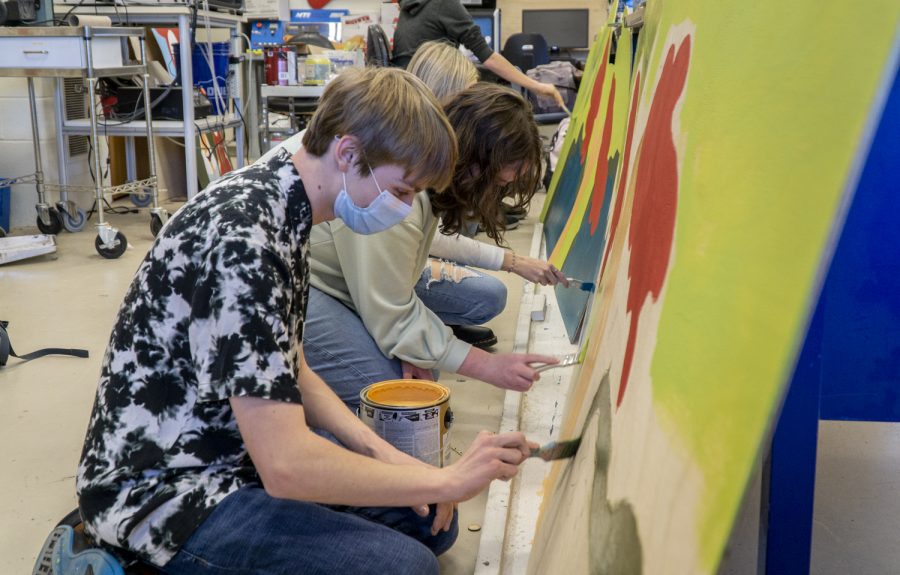 Set Design Co-Head, Junior Alex Reineke, and Freshman Maggie OConnell paint a set for ARHS production of Suessical the Musical.