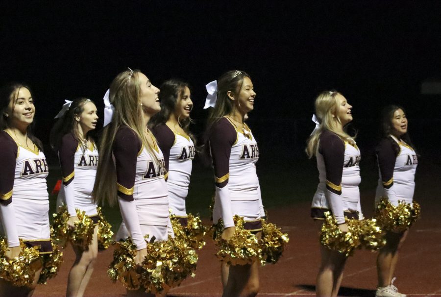 Seniors+Kristina+Callahan%2C+and+Lindsey+Stone+cheer+with+the+rest+of+the+cheerleaders+during+the+football+game+on+Oct.+22.